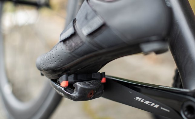 Clipless pedals for road bikes are often only designed on one side, which makes room for a more powerful spring mechanism.